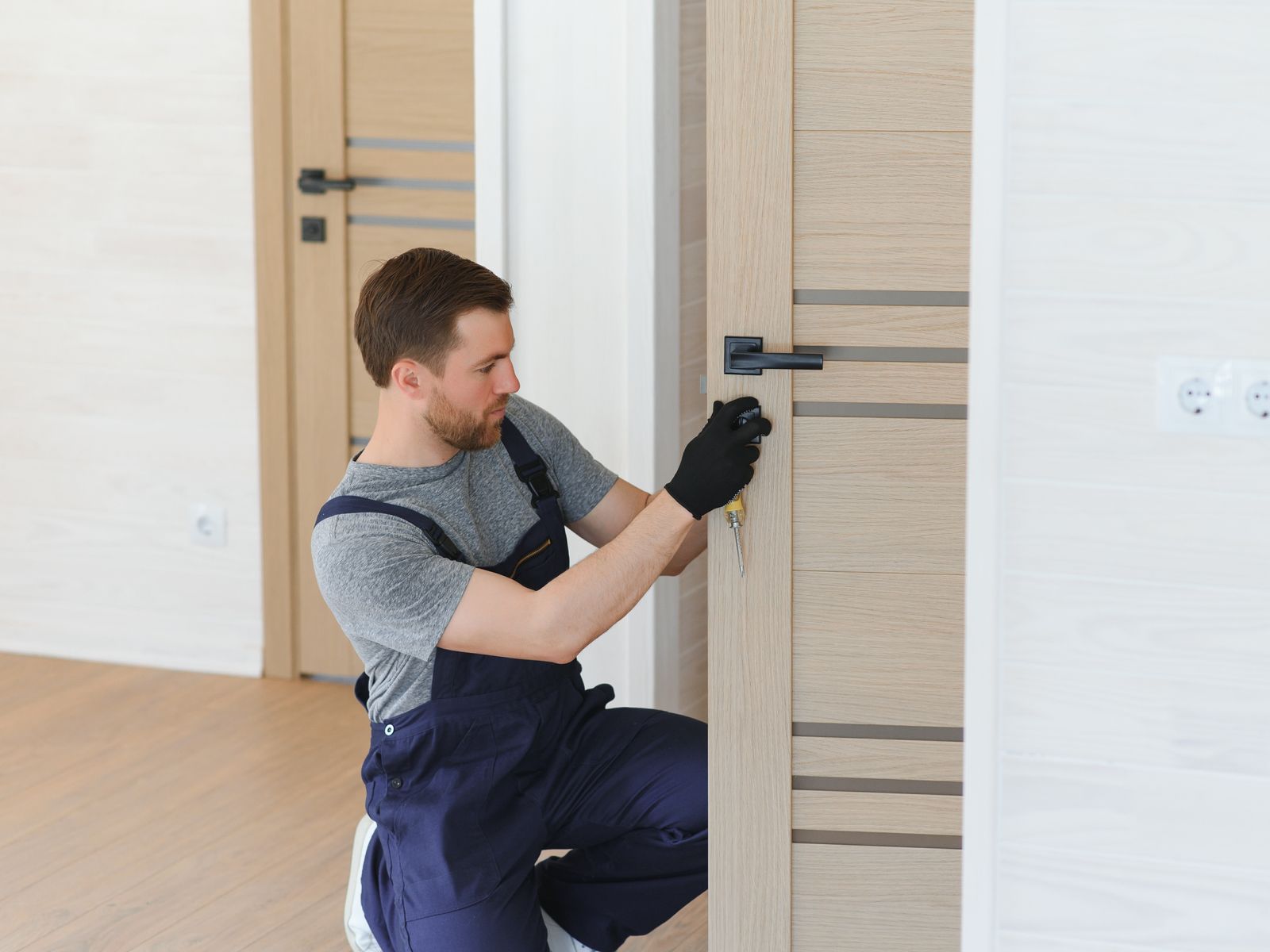 Urban Locksmith technician fitting a lock in Ottawa